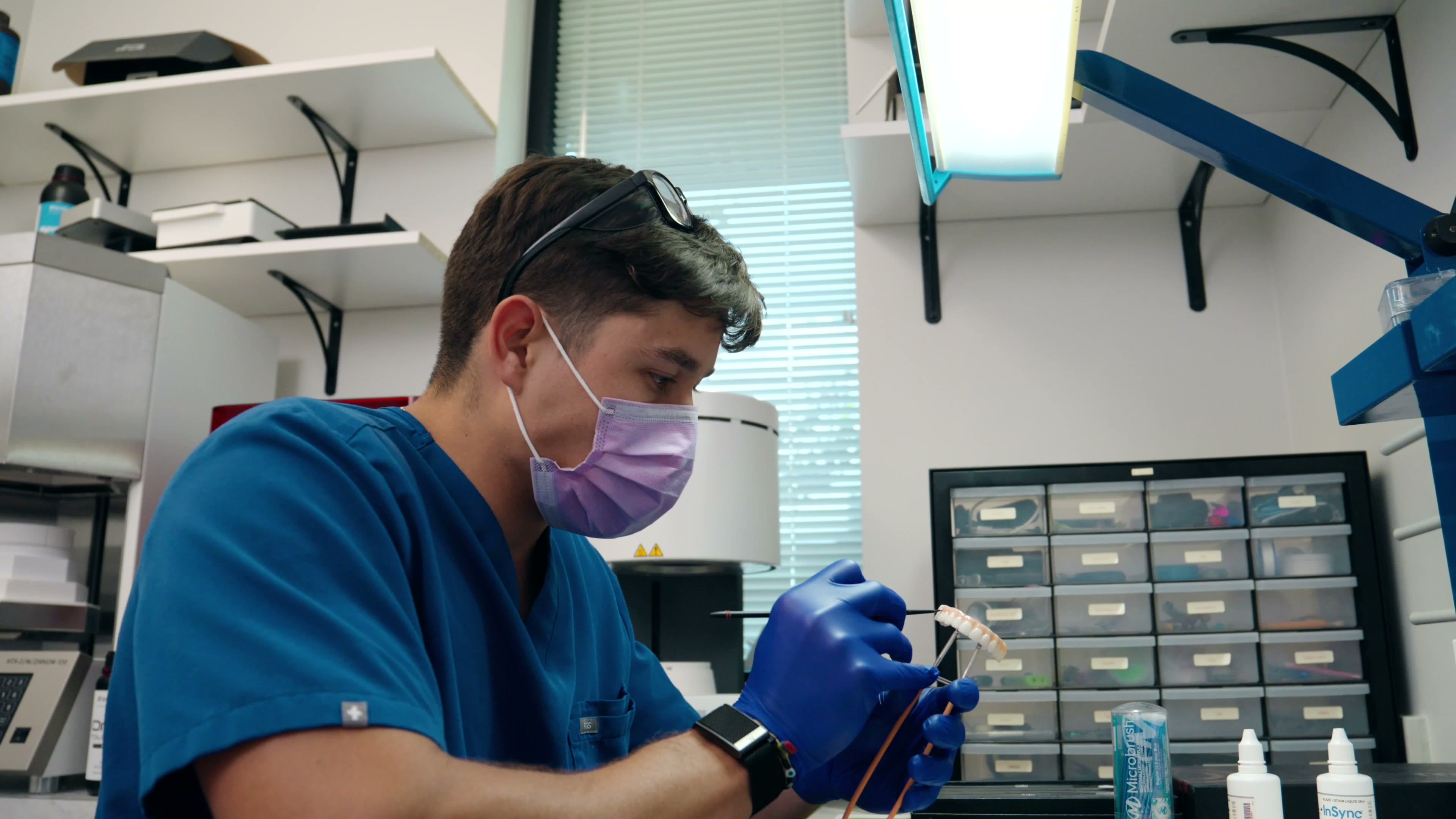 A FixDental clinician preparing a scanner chairside