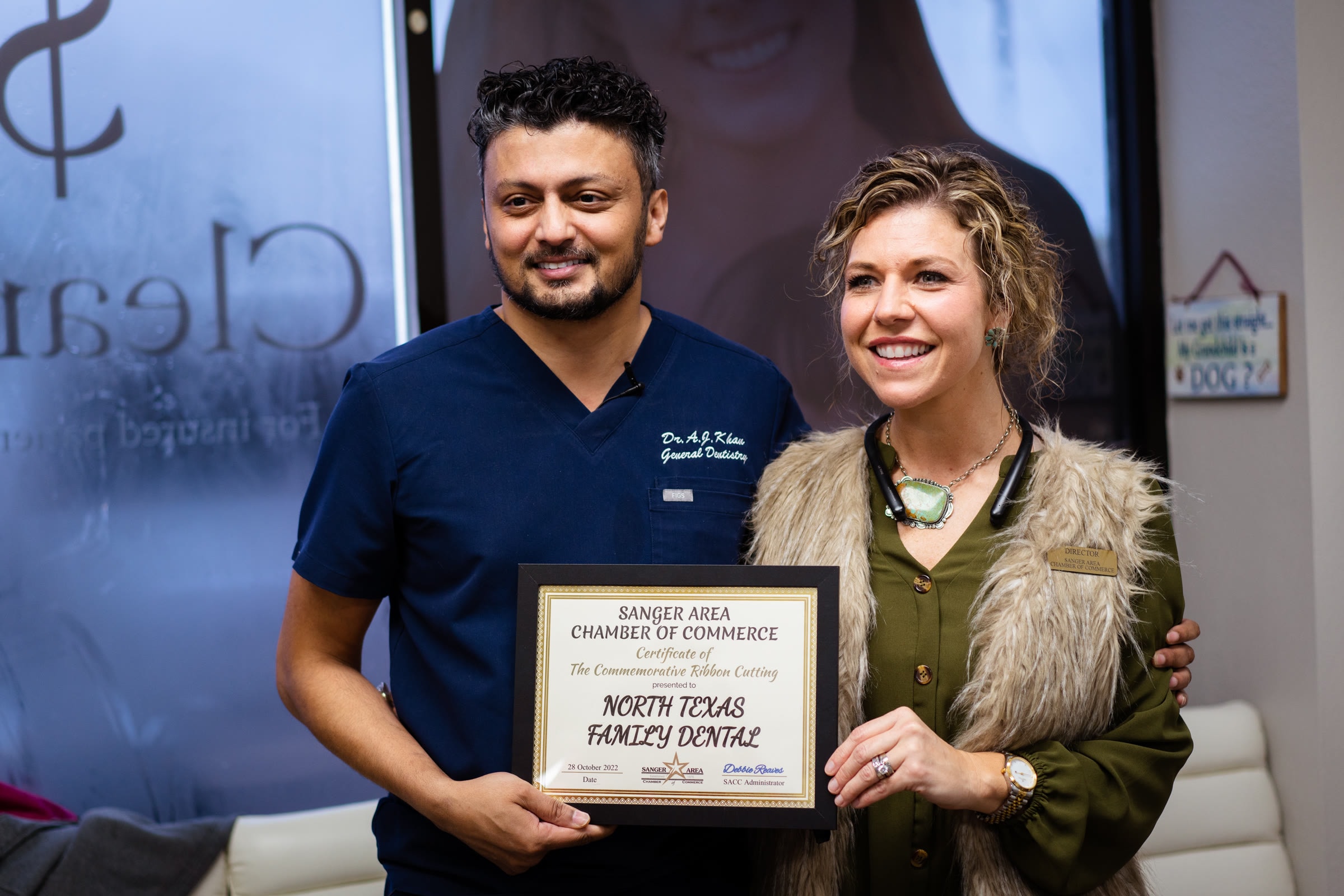 Dr. Khan with the practice's Sanger Area Chamber of Commerce certificate
