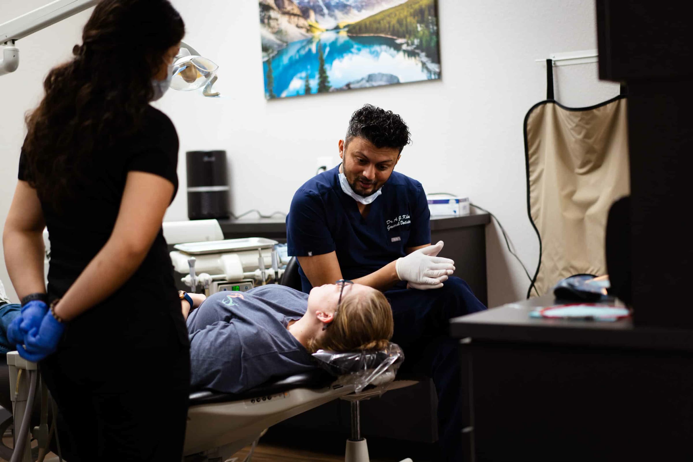 Dr. Khan treating a patient at the Sanger office
